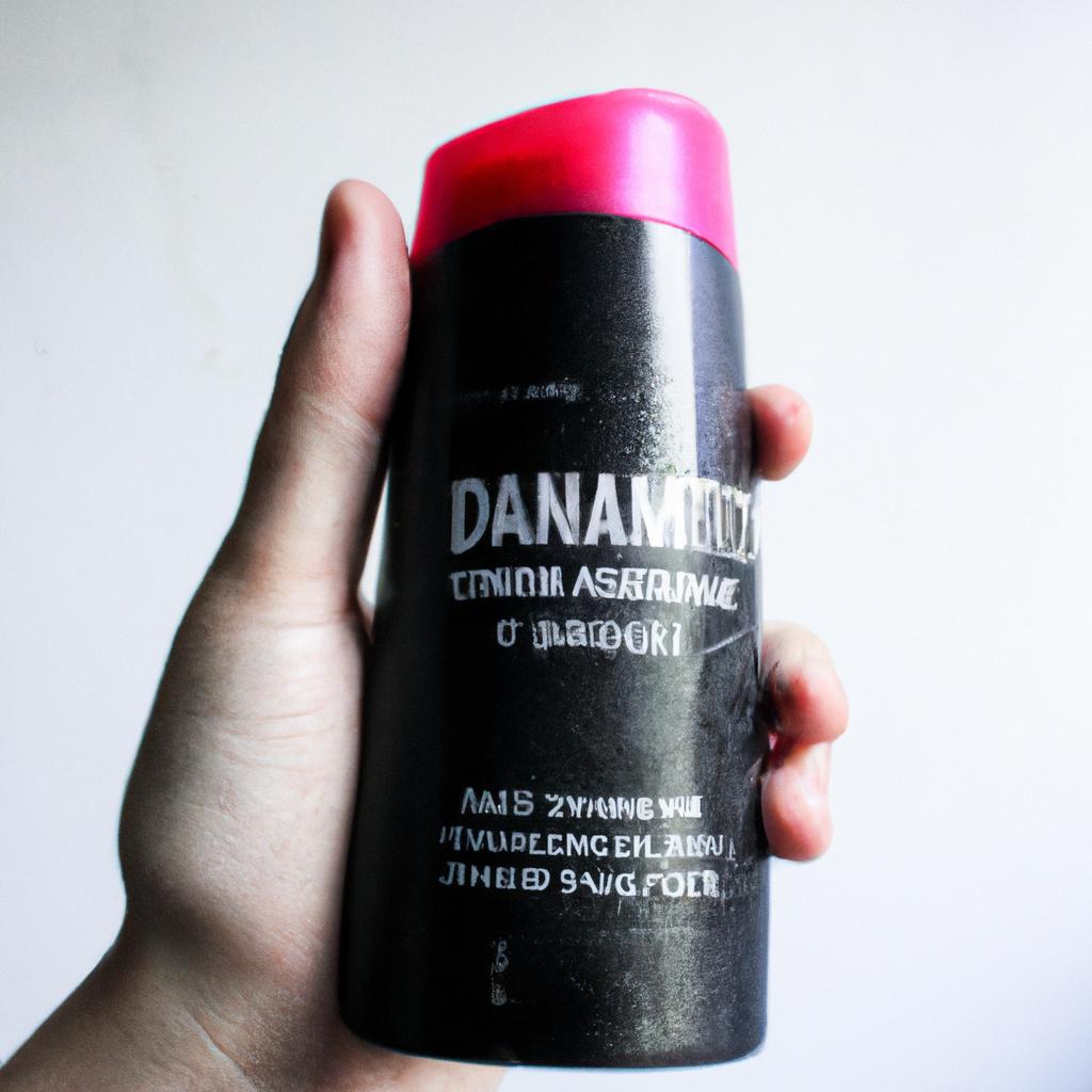 Person holding anti-dandruff shampoo