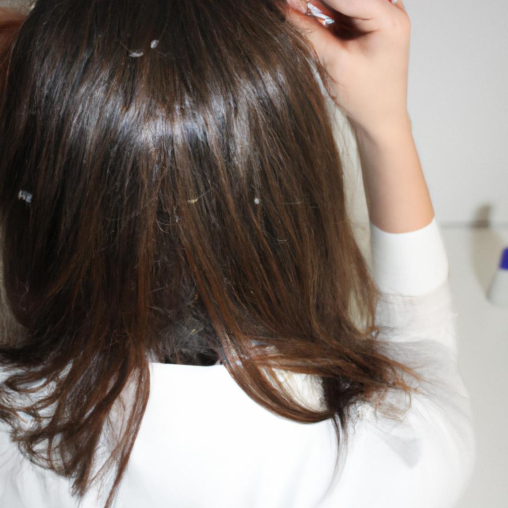 Person researching dandruff causes